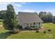 Picturesque single-story home with a large, well-manicured lawn, mature trees, and gray siding at 2268 Bay Ct, Newton, NC 28658