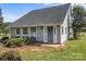 Exterior view featuring a front entrance, windows, and overgrown landscaping at 2268 Bay Ct, Newton, NC 28658