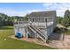 Rear view of home shows the two-story deck, siding, and stairs to access the large deck at 2268 Bay Ct, Newton, NC 28658