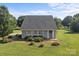 A quaint one-story home featuring a gray exterior, lots of windows and an expansive lawn at 2268 Bay Ct, Newton, NC 28658