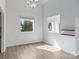 Bright living room features sleek floors, fresh paint, and natural light from the large windows, offering modern comfort and style at 2268 Bay Ct, Newton, NC 28658