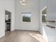 Bright living room features sleek floors, fresh paint, and natural light from the large windows, offering modern comfort and style at 2268 Bay Ct, Newton, NC 28658