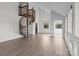 Bright living room features a spiral staircase, large windows, and sleek floors, offering modern comfort and style at 2268 Bay Ct, Newton, NC 28658