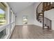 Bright living room features a spiral staircase, large windows, and sleek floors, offering modern comfort and style at 2268 Bay Ct, Newton, NC 28658