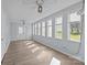 Bright sunroom filled with natural light from numerous windows and featuring light wood floors at 2268 Bay Ct, Newton, NC 28658