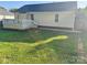 Backyard featuring a well-maintained lawn, a deck, and convenient access to the house at 2289 Kestrel Dr, Rock Hill, SC 29732