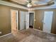 Neutral-toned bedroom with crown molding, ceiling fan, carpeted floor, and plentiful closet space at 2289 Kestrel Dr, Rock Hill, SC 29732