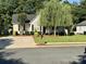 Charming single-story home with mature landscaping, a well-manicured lawn, and welcoming front porch at 2289 Kestrel Dr, Rock Hill, SC 29732