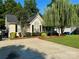 Inviting single-story home with manicured lawn, mature trees, and a spacious driveway at 2289 Kestrel Dr, Rock Hill, SC 29732