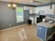 Kitchen with white cabinets, appliances, and eat-in area bathed in natural light at 2289 Kestrel Dr, Rock Hill, SC 29732