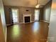 Bright living room with wood floors, fireplace, and access to the backyard at 2289 Kestrel Dr, Rock Hill, SC 29732
