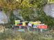 Backyard area with beehives, surrounded by trees and greenery at 250 Nixon Rd # 41, Belmont, NC 28012