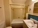 Bathroom with white tiled bathtub, sink, toilet, and blue accent tile at 250 Nixon Rd # 41, Belmont, NC 28012