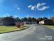 Well-maintained condo community featuring mature trees, landscaping, and convenient parking for residents at 250 Nixon Rd # 41, Belmont, NC 28012