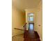 Hallway with wood floors, stairs, and doorway leading to bedroom with ceiling fan at 250 Nixon Rd # 41, Belmont, NC 28012