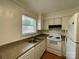 Traditional kitchen featuring a stainless steel sink, white cabinets, and essential appliances at 250 Nixon Rd # 41, Belmont, NC 28012
