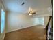 Bright living room featuring wood-look floors, neutral walls, and a ceiling fan at 250 Nixon Rd # 41, Belmont, NC 28012