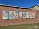 Mural on the side of a brick building with vivid floral art at 250 Nixon Rd # 41, Belmont, NC 28012