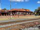 Charming train station with a red tile roof and brick exterior, offering a glimpse into local history at 250 Nixon Rd # 41, Belmont, NC 28012