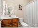 Bathroom featuring a classic vanity and a bathtub with a shower curtain at 2773 Clover Nw Rd, Concord, NC 28027