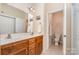 Bathroom featuring a double sink vanity and a separate toilet room for added privacy at 2773 Clover Nw Rd, Concord, NC 28027