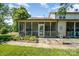 Cozy screened porch with beautiful landscaping in a residential neighborhood at 2773 Clover Nw Rd, Concord, NC 28027