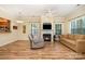 Inviting living room featuring a fireplace, hardwood floors, and natural light at 2773 Clover Nw Rd, Concord, NC 28027