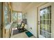 A relaxing screened porch with rocking chairs and pleasant outdoor views at 2773 Clover Nw Rd, Concord, NC 28027