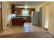 Retro kitchen featuring original cabinets, a window, and appliances, offering vintage charm at 3009 Grier St, Newton, NC 28658