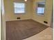 Living room with neutral walls, carpet and large windows provides a bright, inviting space at 3009 Grier St, Newton, NC 28658