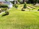 Large, verdant backyard showcasing well-maintained lawn and ample space at 3011 Ella Katherine Way, Charlotte, NC 28210