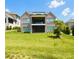Spacious backyard with a large green lawn and view of the house with a balcony at 3011 Ella Katherine Way, Charlotte, NC 28210