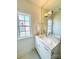 Elegant bathroom with marble countertop and vanity with updated lighting at 3011 Ella Katherine Way, Charlotte, NC 28210