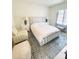 Cozy bedroom with neutral color scheme, stylish furnishings, and ample natural light at 3011 Ella Katherine Way, Charlotte, NC 28210
