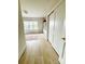 Bedroom entryway with pristine hardwood floors and sliding closet doors at 3011 Ella Katherine Way, Charlotte, NC 28210