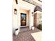 Charming brick home featuring a classic wood front door, flanked by elegant planters at 3011 Ella Katherine Way, Charlotte, NC 28210