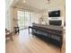 Bright living room with fireplace, large sliding doors, and elegant hardwood flooring at 3011 Ella Katherine Way, Charlotte, NC 28210