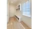 Mudroom with storage lockers, hooks and bench seating by a window at 3011 Ella Katherine Way, Charlotte, NC 28210