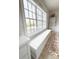 Large window seat in a naturally lit room, with built-in storage and hardwood floors at 3011 Ella Katherine Way, Charlotte, NC 28210