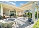 Outdoor patio space featuring a pergola, fire pit, grill and comfortable seating at 3899 Zemosa Nw Ln, Concord, NC 28027