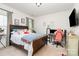 Charming bedroom with a comfortable bed, natural light, and a dedicated workspace for productivity at 3899 Zemosa Nw Ln, Concord, NC 28027