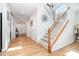 Welcoming entryway with hardwood floors and staircase at 3899 Zemosa Nw Ln, Concord, NC 28027