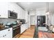 Kitchen featuring stainless steel appliances, granite countertops, white cabinetry and an undermount sink at 3899 Zemosa Nw Ln, Concord, NC 28027