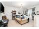 Comfortable living room featuring a cozy sofa, built-in bookcase, and ample natural light at 3899 Zemosa Nw Ln, Concord, NC 28027
