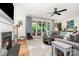 Spacious living room with fireplace and sliding door access to the backyard patio at 3899 Zemosa Nw Ln, Concord, NC 28027