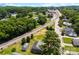 Scenic aerial view of a neighborhood near train tracks and green trees, offering peaceful surroundings at 400 N Main Gq St, Granite Quarry, NC 28146