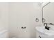 Modern bathroom with white vanity, black fixtures, and a sleek mirror design at 400 N Main Gq St, Granite Quarry, NC 28146