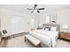 Bright bedroom featuring a ceiling fan, hardwood floors, and neutral decor at 400 N Main Gq St, Granite Quarry, NC 28146