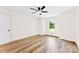 Bedroom featuring hardwood floors, a ceiling fan, and a window at 400 N Main Gq St, Granite Quarry, NC 28146