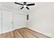 Inviting bedroom with hardwood floors, a closet, and a modern ceiling fan at 400 N Main Gq St, Granite Quarry, NC 28146